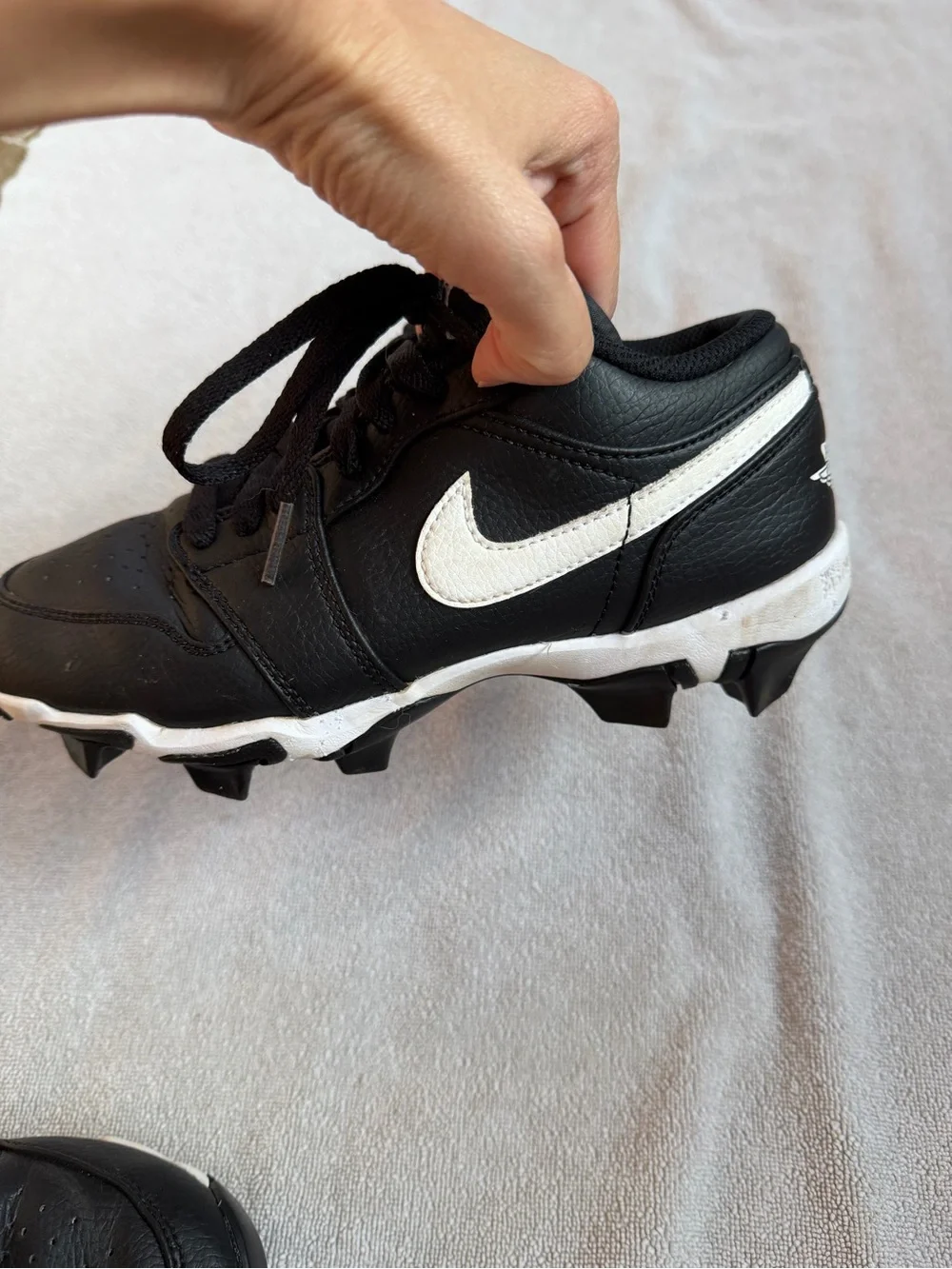 Nike Kids Black and White Baseball Cleats with Swoosh